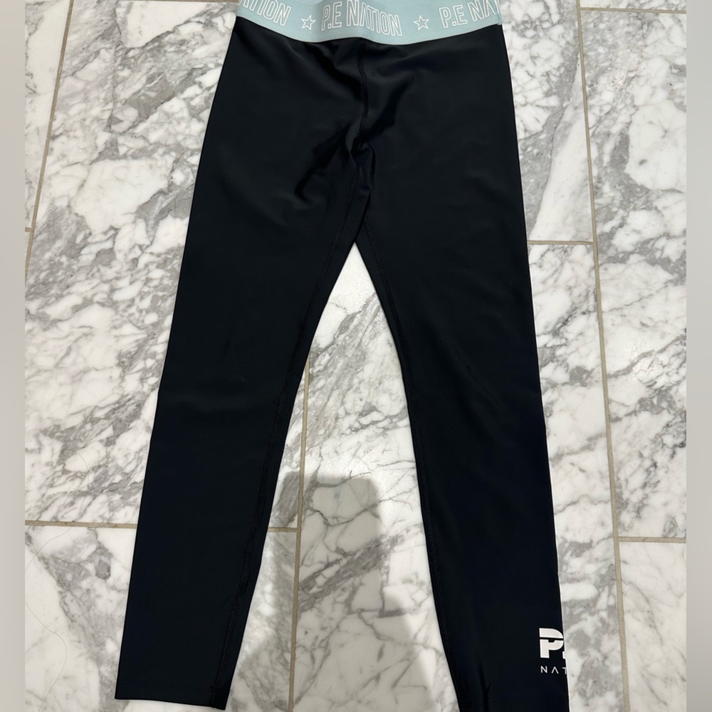P.E Nation Power Up Kick Force Mid-Rise Leggings.